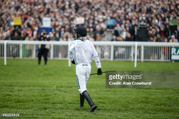 Jockey Nico de Boinville makes his return after falling from Brain Power at Aintree racecourse on April 12, 2018 in Liverpool, England.