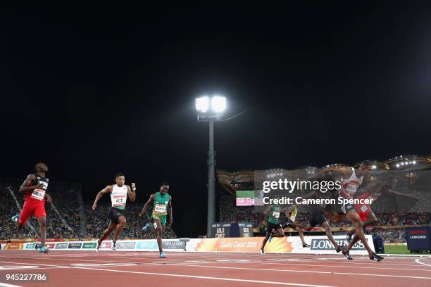 Zharnel Hughes of England crosses the line to win gold ahead of Jereem Richards of Trinidad and Tobago inthe Men's 200 metres final during athletics...