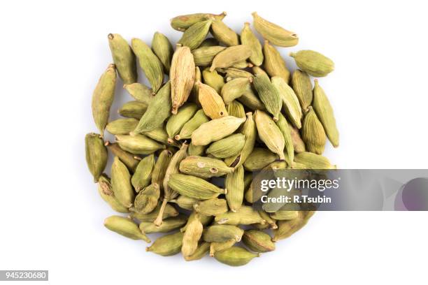 heap of cardamom pods - cardamom stock pictures, royalty-free photos & images