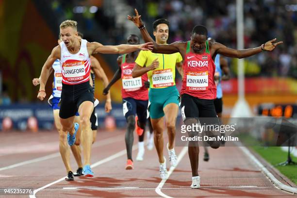 Wycliffe Kinyamal of Kenya crosses the line to win gold ahead of Kyle Langford of England in the Men's 800 metres final during athletics on day eight...