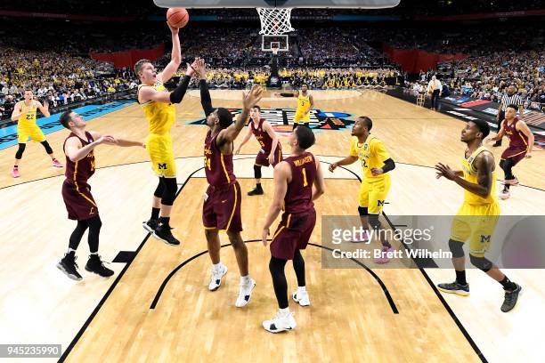 Moritz Wagner of the Michigan Wolverines shoots the ball against the Loyola Ramblers in the 2018 NCAA Photos via Getty Images Men's Final Four...