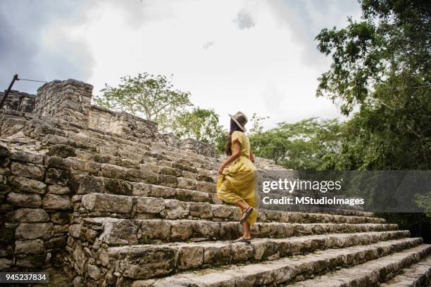 tourist woman at coba pyramids. - coba ruins stock pictures, royalty-free photos & images
