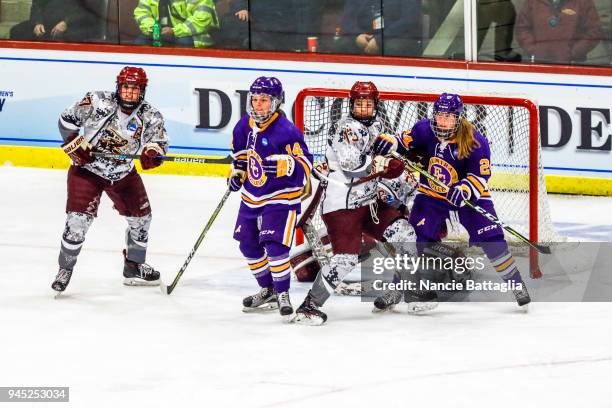 Players of Elmira College and Norwich University fight for control in from tof the Norwich goal during the Division III Women's Ice Hockey...