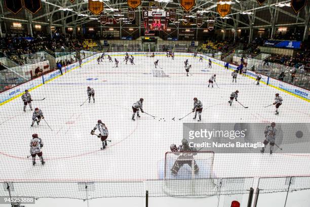 Players of both Norwich University and Elmira College warm up before the start of the Division III Women's Ice Hockey Championship held at Kreitzberg...