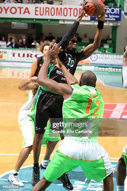 Romain Sato, #10 of Montepaschi Siena takes a rebound over Ali Traore, #12 of Asvel Villeurbane during the Euroleague Basketball Regular Season...