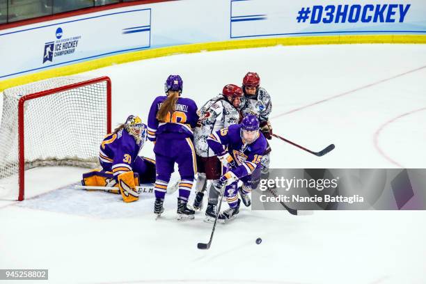 Kiana Melvin, of Elmira College moves the puck out of traffic during the Division III Women's Ice Hockey Championship, between Norwich University and...