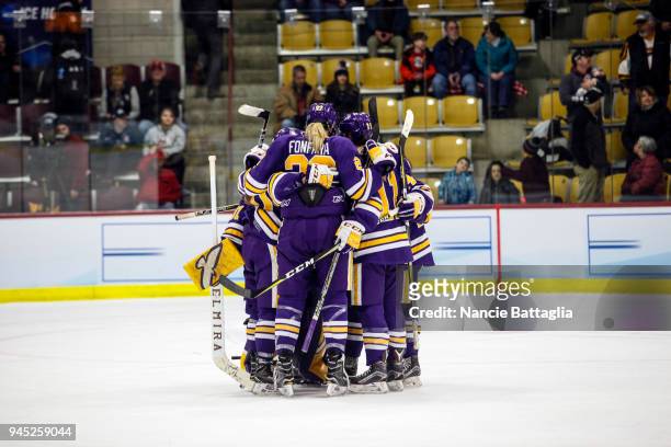 Elmira players huddle together on the ice after having the go-ahead goal scored on them by Norwich University during the Division III Women's Ice...