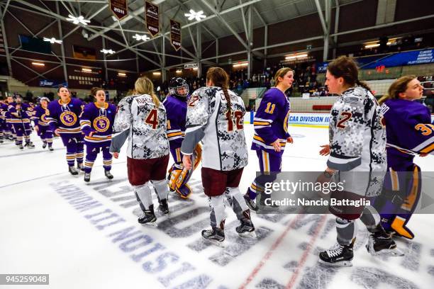 Players shake hands after Norwich defeated Elmira College 2-1 in the Division III Women's Ice Hockey Championship game, March 17 at Kreitzberg Arena...