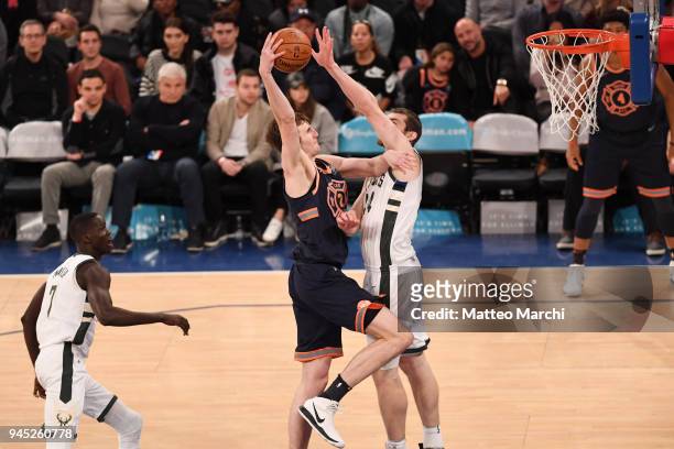 Luke Kornet of the New York Knicks dunks the ball against Tyler Zeller of the Milwaukee Bucks at Madison Square Garden on April 7, 2018 in New York...