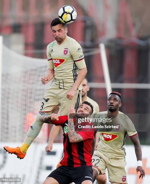 Anel Hadzic of Videoton FC battles for the ball in the air with Davide Lanzafame of Budapest Honved in front of Ianique dos Santos Tavares 'Stopira'...