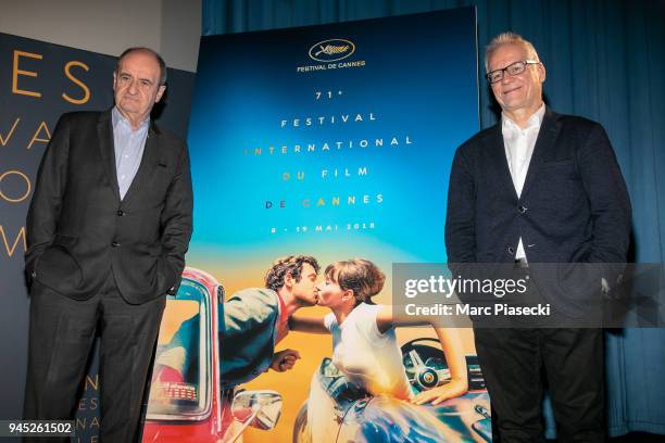 Pierre Lescure and Thierry Fremaux pose in front of the Cannes Film Festival official poster during the Cannes Film Festival Press Conference at...