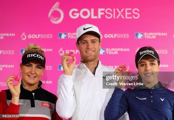 Charley Hull of England, Lucas Bjerregaard of Denmark and Georgia Hall of England pose for a photo after selecting for the draw during the GolfSixes...