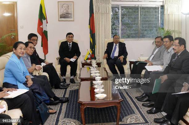 Bangladesh Foreign Minister Abul Hasan Mahmud Ali sits next to Myanmar Social Welfare Minister Win Myat Aye during their meeting in Dhaka on April...