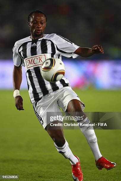 Mabi Mputu of TRP Mazembe runs with the ball during the FIFA Club World Cup semi-final match between Atlante and Barcelona at the t the Zayed Sports...