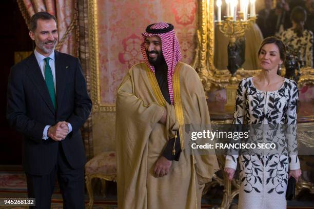 Spain's king Felipe VI poses with his wife queen Letizia and Saudi crown prince Mohammed bin Salman before a lunch at the Royal Palace in Madrid on...