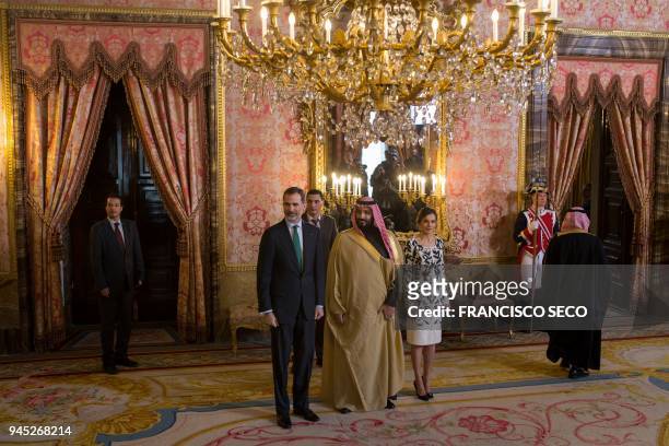 Spain's king Felipe VI poses with his wife queen Letizia and Saudi crown prince Mohammed bin Salman before a lunch at the Royal Palace in Madrid on...