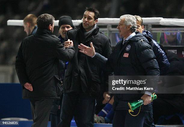 Head coach Friedhelm Funkel, manager Michael Preetz and goalkeeper coach Nello di Martino are seen after the UEFA Europa League match between Hertha...