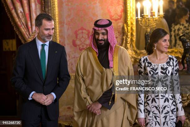 Spain's king Felipe VI poses with his wife queen Letizia and Saudi crown prince Mohammed bin Salman before a lunch at the Royal Palace in Madrid on...