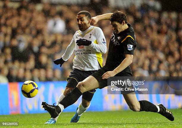 Aaron Lennon of Spurs is tackled by Gareth Barry of Manchester City during the Barclays Premier League match between Tottenham Hotspur and Manchester...