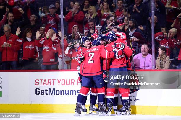 Alex Chiasson of the Washington Capitals celebrates with his teammates after scoring a first period goal against the Columbus Blue Jackets at Capital...