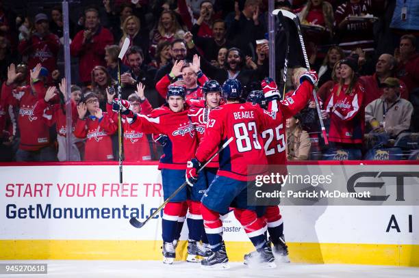 Alex Chiasson of the Washington Capitals celebrates with his teammates after scoring a first period goal against the Columbus Blue Jackets at Capital...