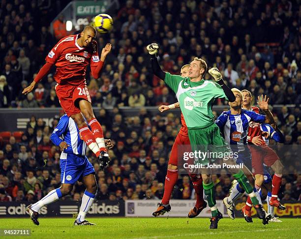 David Ngog of Liverpool heads a goal past Chris Kirkland of Wigan during the Barclays Premier League match between Liverpool and Wigan Athletic at...