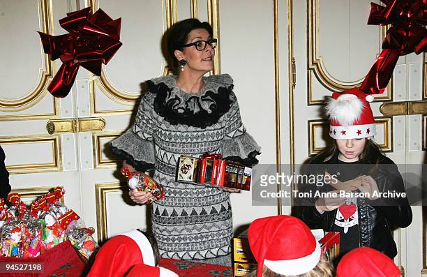 Princess Caroline of Hanover and Princess Alexandra of Hanover distribute presents for the Monaco Christmas Tree at Monaco Palace on December 16,...