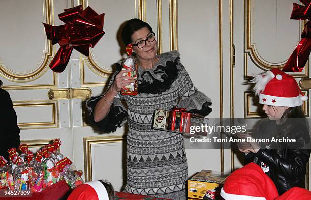 Princess Caroline of Hanover and Princess Alexandra of Hanover distribute presents for the Monaco Christmas Tree at Monaco Palace on December 16,...