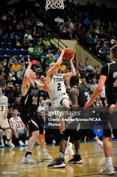 Ben Boots of Univ. Wisconsin-Oshkosh drives to the hoop during the Division III Men's Basketball Championship held at the Salem Civic Center on March...