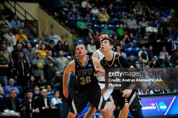 Copper Cook and Jack Hiller of Nebraska Wesleyan box out during the Division III Men's Basketball Championship held at the Salem Civic Center on...