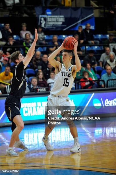 Adam Fravert of Univ. Wisconsin-Oshkosh looks to pass during the Division III Men's Basketball Championship held at the Salem Civic Center on March...