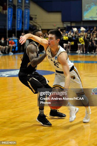 Brett Wittchow of Univ. Wisconsin-Oshkosh drives to the basket during the Division III Men's Basketball Championship held at the Salem Civic Center...