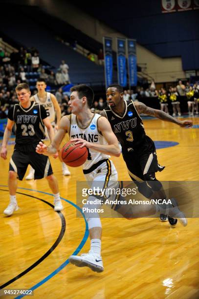 Brett Wittchow of Univ. Wisconsin-Oshkosh drives to the basket during the Division III Men's Basketball Championship held at the Salem Civic Center...