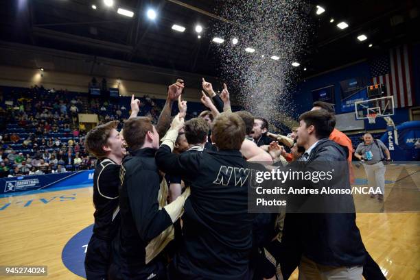 Players of Nebraska Wesleyan celebrate after winning the Division III Men's Basketball Championship held at the Salem Civic Center on March 17, 2018...