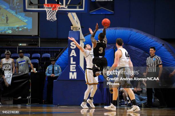 Deion Wells-Ross of Nebraska Wesleyan puts up a contested lay-up during the Division III Men's Basketball Championship held at the Salem Civic Center...