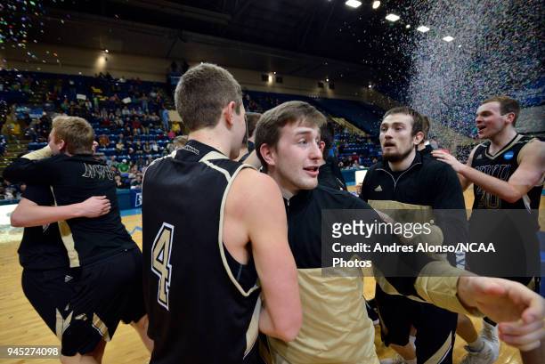 Players of Nebraska Wesleyan celebrate after winning the Division III Men's Basketball Championship held at the Salem Civic Center on March 17, 2018...