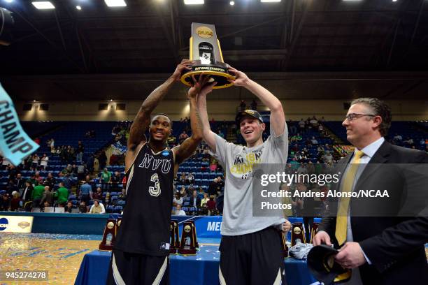 Deion Walls-Ross and Cooper Cook hoist their trophy after winning the Division III Men's Basketball Championship held at the Salem Civic Center on...