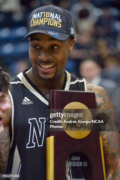 Deion Walls-Ross stands with the championship trophy after winning the Division III Men's Basketball Championship held at the Salem Civic Center on...
