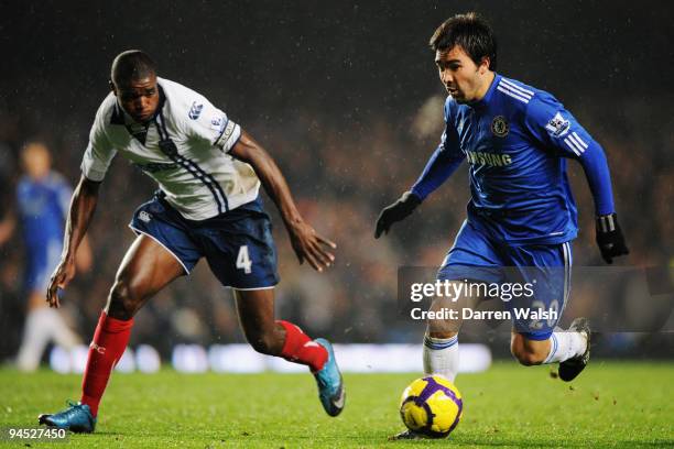 Deco of Chelsea holds off the challenge of Aaron Mokoena of Portsmouth during the Barclays Premier League match between Chelsea and Portsmouth at...