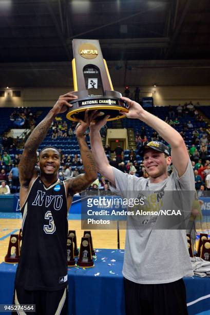 Deion Walls-Ross and Cooper Cook hoist their trophy after winning the Division III Men's Basketball Championship held at the Salem Civic Center on...