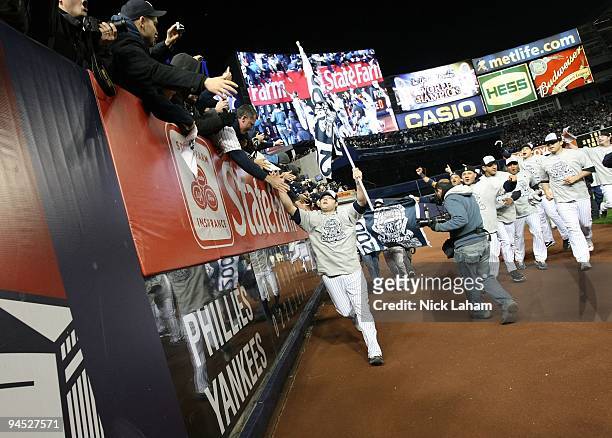 Joba Chamberlain of the New York Yankees celebrates with fans after their 7-3 win against the Philadelphia Phillies in Game Six of the 2009 MLB World...
