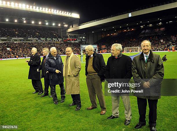 Bill Shankly's legendary team stand at Anfield and await the current Liverpool team during the Barclays Premier League match between Liverpool and...