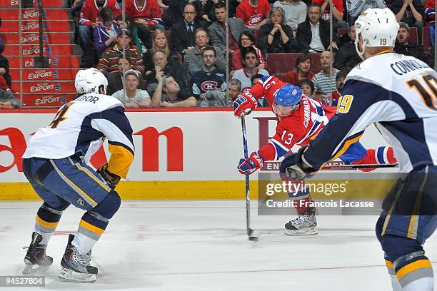 Mike Cammalleri of the Montreal Canadiens takes a shot to the goal during the NHL game against the Buffalo Sabres on December 14, 2009 at the Bell...