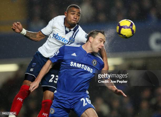 Kevin-Prince Boateng of Portsmouth competes against John Terry of Chelsea during the Barclays Premier League match between Chelsea and Portsmouth at...