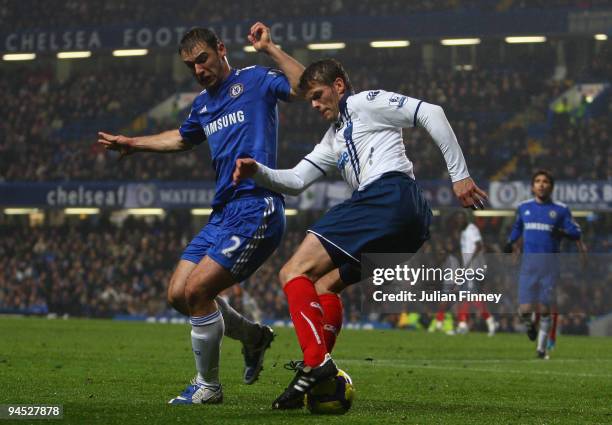 Branislav Ivanovic of Chelsea battles with Hermann Hreidarsson of Portsmouth during the Barclays Premier League match between Chelsea and Portsmouth...