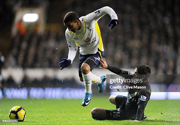 Aaron Lennon of Spurs is tackled by Sylvinho of Manchester City during the Barclays Premier League match between Tottenham Hotspur and Manchester...