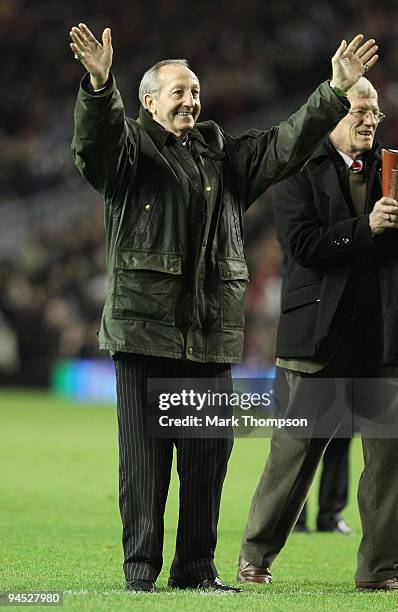 Former Liverpool player Gerry Byrne waves to the the crowd at half time as the 50th anniversary of the day Bill Shankly first took charge of a...