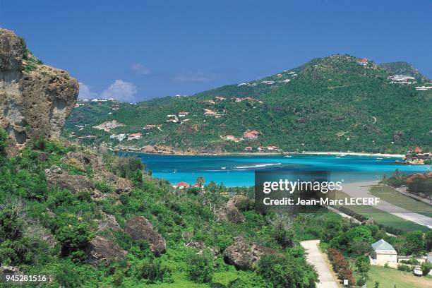 West indies saint barthelemy saint jean bay airport landing runway beach architecture houses antilles saint barthelemy baie de saint jean aeroport...