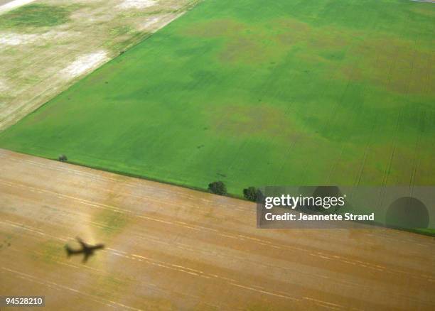 window view from plane - airplane shadow stock pictures, royalty-free photos & images