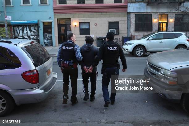 Immigration and Customs Enforcement , officers arrest an undocumented Mexican immigrant during a raid in the Bushwick neighborhood of Brooklyn on...